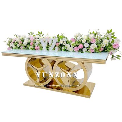 Καλή τιμή Μοντέρνο χρυσό ορθογώνιο τραπέζι τραπεζαρίας με βάση Benz, πολυτελές έπιπλο για εκδηλώσεις γάμου για εξωτερική χρήση και ξενοδοχείο, γυάλινη/MDF επιφάνεια σε απευθείας σύνδεση